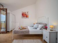 Łóżko lub łóżka w pokoju w obiekcie Villa Chiara