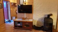 TV a/nebo společenská místnost v ubytování Solbjørnlia Apartments