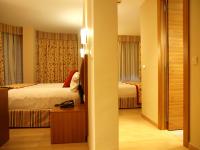 Ein Bett oder Betten in einem Zimmer der Unterkunft Hotel Guillem &amp; Spa