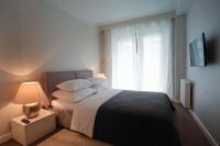 Posteľ alebo postele v izbe v ubytovaní Oxygen Residence