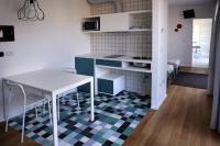A kitchen or kitchenette at Mxp Rooms Guest House