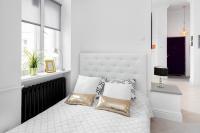 Łóżko lub łóżka w pokoju w obiekcie Apartments Warsaw City Center by Noclegi Renters
