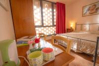 A bed or beds in a room at La Sorgente