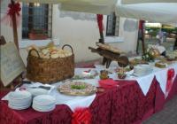 a table with plates and a basket of food on it at Ristorante Alloggio Ostello Amolara in Adria