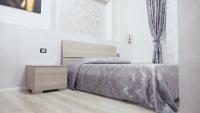 A bed or beds in a room at L'Antenna