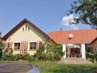 a white house with a red roof at Landhaus Steirerengel - Ferien &amp; Jagd in Lócs