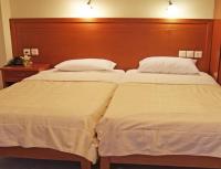 A bed or beds in a room at Neon Studios