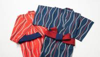 three ties are tied together with a red bow at The Prince Gallery Tokyo Kioicho, a Luxury Collection Hotel in Tokyo