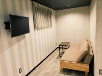 ホテルカプセルイン静岡にあるテレビまたはエンターテインメントセンター