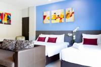 Postel nebo postele na pokoji v ubytování FX Hotel Pattaya