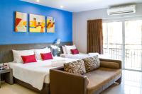 Postel nebo postele na pokoji v ubytování FX Hotel Pattaya