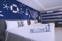 Postel nebo postele na pokoji v ubytování FX Hotel Pattaya