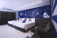Postel nebo postele na pokoji v ubytování FX Hotel Pattaya