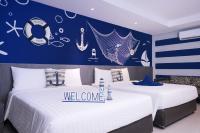 Postel nebo postele na pokoji v ubytování FX Hotel Pattaya