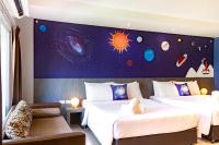Postel nebo postele na pokoji v ubytování FX Hotel Pattaya