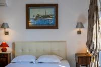 a bedroom with a bed with a picture on the wall at AU BEAU RIVAGE AP2049 by RIVIERA HOLIDAY HOMES in Nice