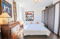 a bedroom with a bed and a dresser and a desk at AU BEAU RIVAGE AP2049 by RIVIERA HOLIDAY HOMES in Nice