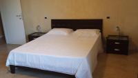 Posteľ alebo postele v izbe v ubytovaní B&B Azzurra