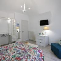 A bed or beds in a room at La Casetta di Meta