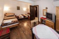Postel nebo postele na pokoji v ubytování Keremidchieva Kushta Guest House