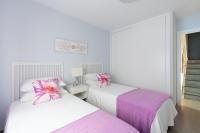 A bed or beds in a room at UNIQUE HOMES LAS SETAS LA CAMPANA