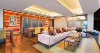 a living room with a couch and a table at The Prince Gallery Tokyo Kioicho, a Luxury Collection Hotel in Tokyo