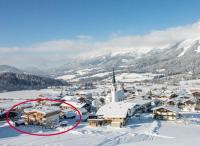 a town in the snow with a red circle at Alpen Chalet ELLMAU Zentrum in Ellmau