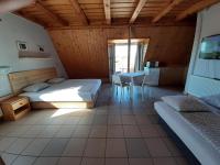 Posteľ alebo postele v izbe v ubytovaní Família Apartmanház