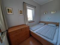 Posteľ alebo postele v izbe v ubytovaní Família Apartmanház