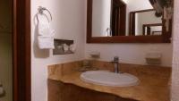 a bathroom with a sink and a mirror at Ecotel Quinta Regia in Valladolid