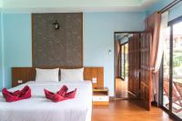 Ein Bett oder Betten in einem Zimmer der Unterkunft Chomview Resort