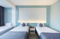 At the Train Chiang Mai Hotelにあるベッド