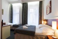 Postel nebo postele na pokoji v ubytování Hotel Atos