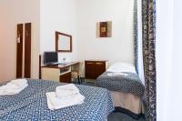 Postel nebo postele na pokoji v ubytování Hotel Atos