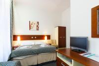 Postel nebo postele na pokoji v ubytování Hotel Atos