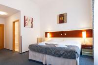 Postel nebo postele na pokoji v ubytování Hotel Atos