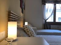 Łóżko lub łóżka w pokoju w obiekcie MilanHolidays