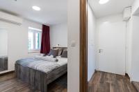 Posteľ alebo postele v izbe v ubytovaní Apinelo Port Rooms