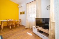 Televízia a/alebo spoločenská miestnosť v ubytovaní History Apartments Center