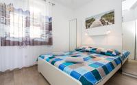 Posteľ alebo postele v izbe v ubytovaní Apartment Natalija
