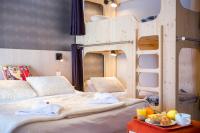 a bedroom with two bunk beds and a tray of food at Hôtel Club mmv Le Flaine *** in Flaine