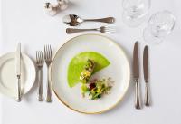 un plato de comida en una mesa con cubiertos en The Royal Duchy Hotel, en Falmouth