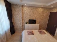 Postel nebo postele na pokoji v ubytování City Center Lux Apartment