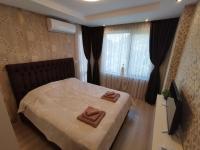 Postel nebo postele na pokoji v ubytování City Center Lux Apartment