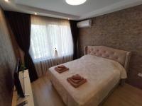 Postel nebo postele na pokoji v ubytování City Center Lux Apartment
