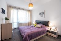 Postel nebo postele na pokoji v ubytování NC Apartment Ruse