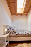 a bedroom with a bed and a window at Kitz Mountain Living in Aurach bei Kitzbuhel