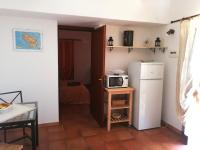 A kitchen or kitchenette at Dammuso Surya Cloe