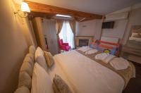 Postel nebo postele na pokoji v ubytování Ağva Carpediem Otel