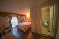 Postel nebo postele na pokoji v ubytování Ağva Carpediem Otel